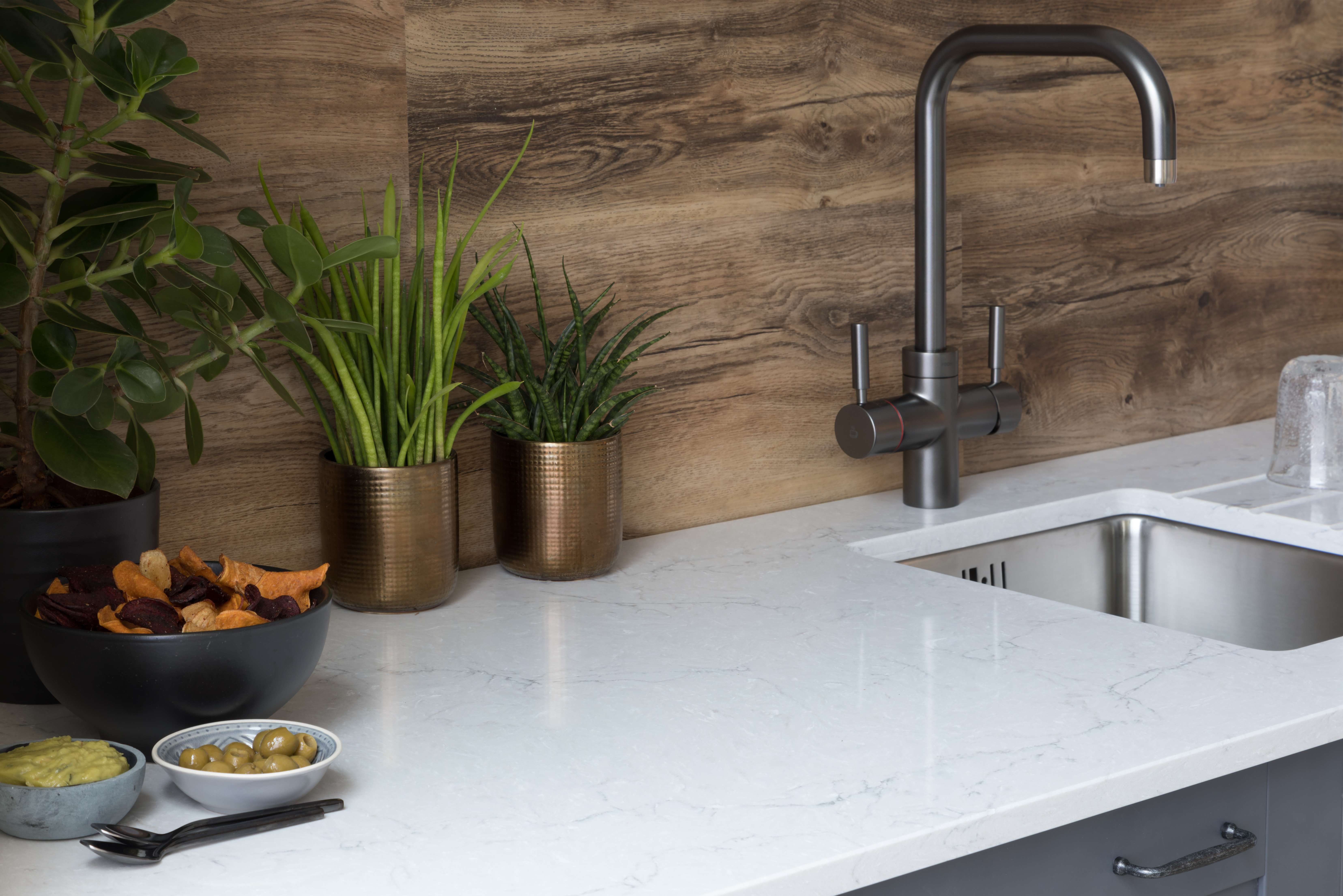 Matte black worktops finds its surface match with CRL Quartz Vicenza