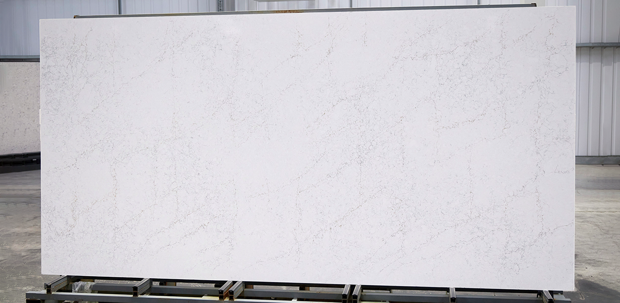 Full Slab view of Antonella Quartz with a crisp white surface and distinctive grey, brown veining.