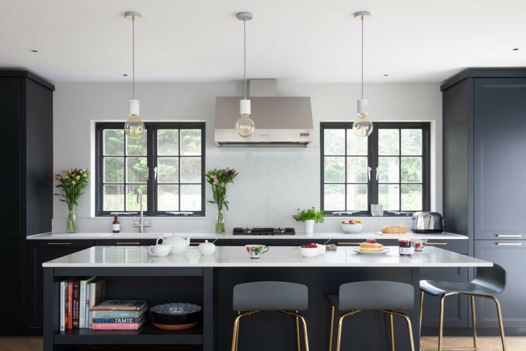 Blue kitchen with white quartz worktop kitchen island