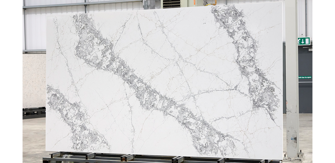 Full Slab view of Pantheon Gray Quartz with a simple white backdrop, and the gray veining