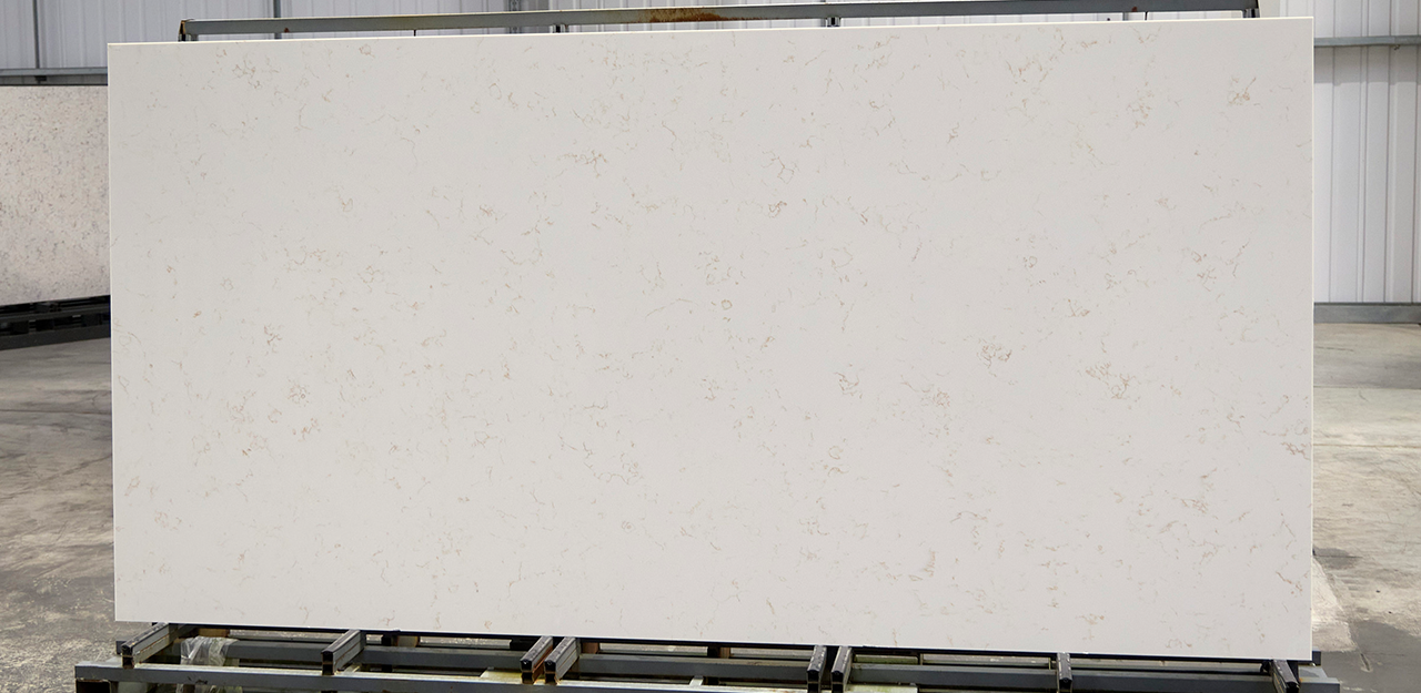 Full Slab view of Verona Gold Quartz with a creamy white background and delicate gold veining