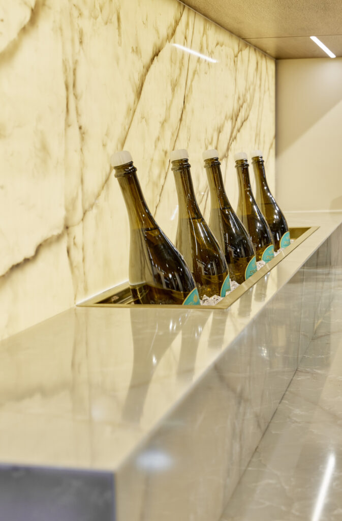 Backlighting Quartz Surface installed in a bar using Cristallo Perla