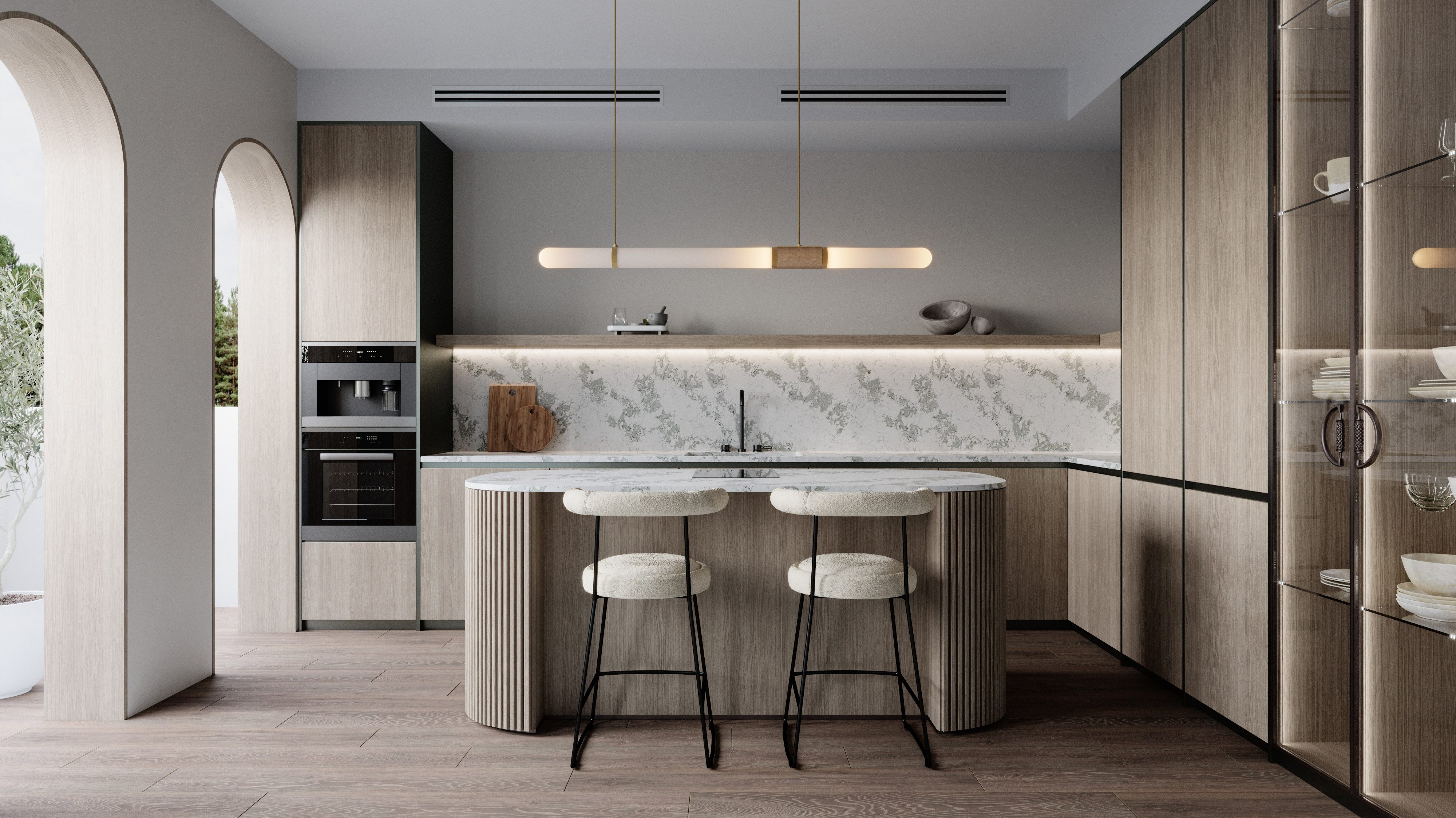 A kitchen Island with Statuario Verde