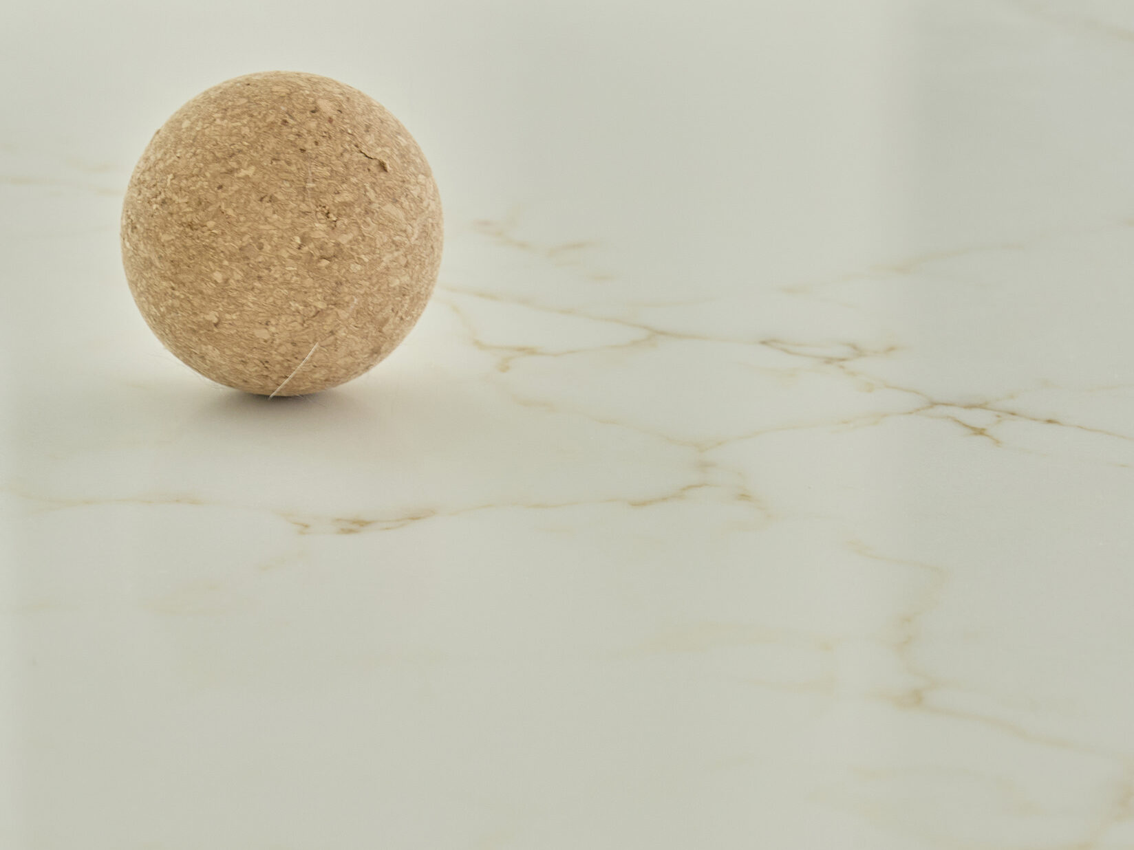 A close up of CRL Stone Statuario Oro surface